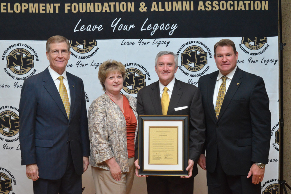 hall of fame inductee travis Childers and white along with president Ricky ford and vp Patrick eaton