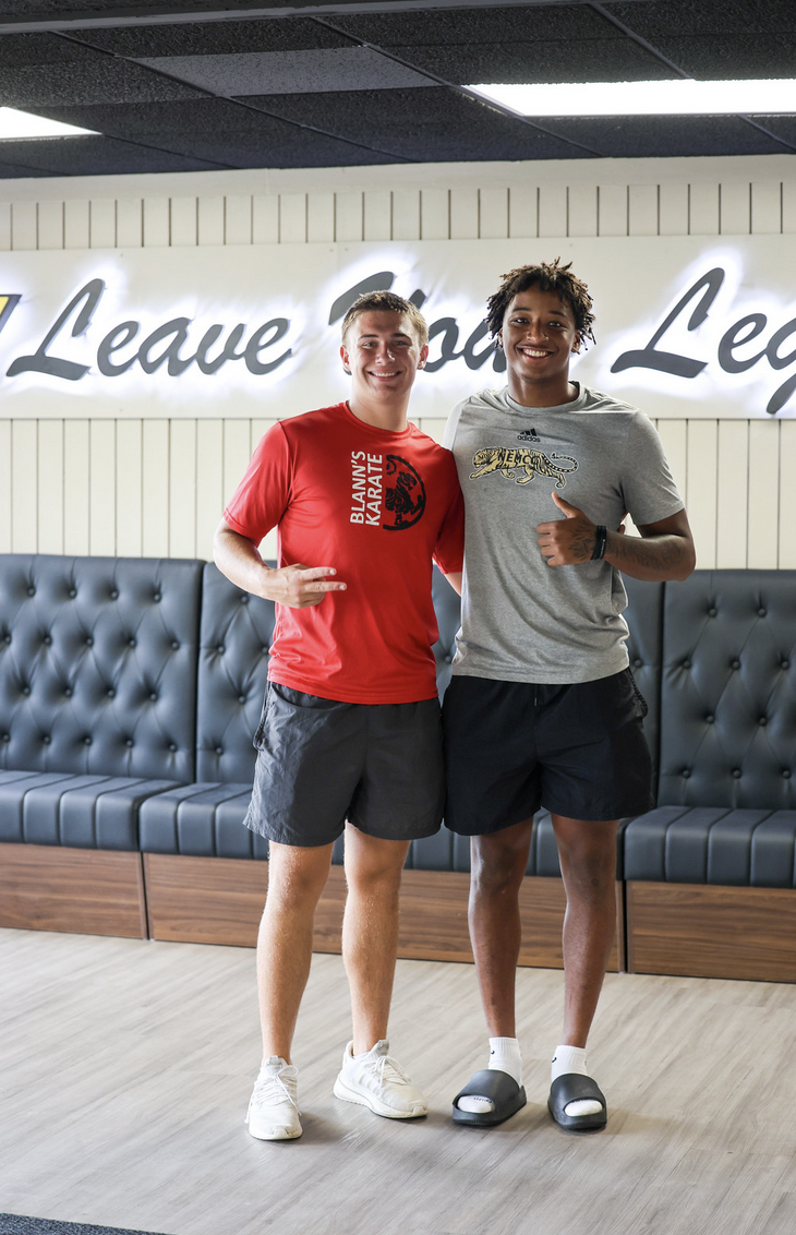 Two students standing in lobby of renovated dorm