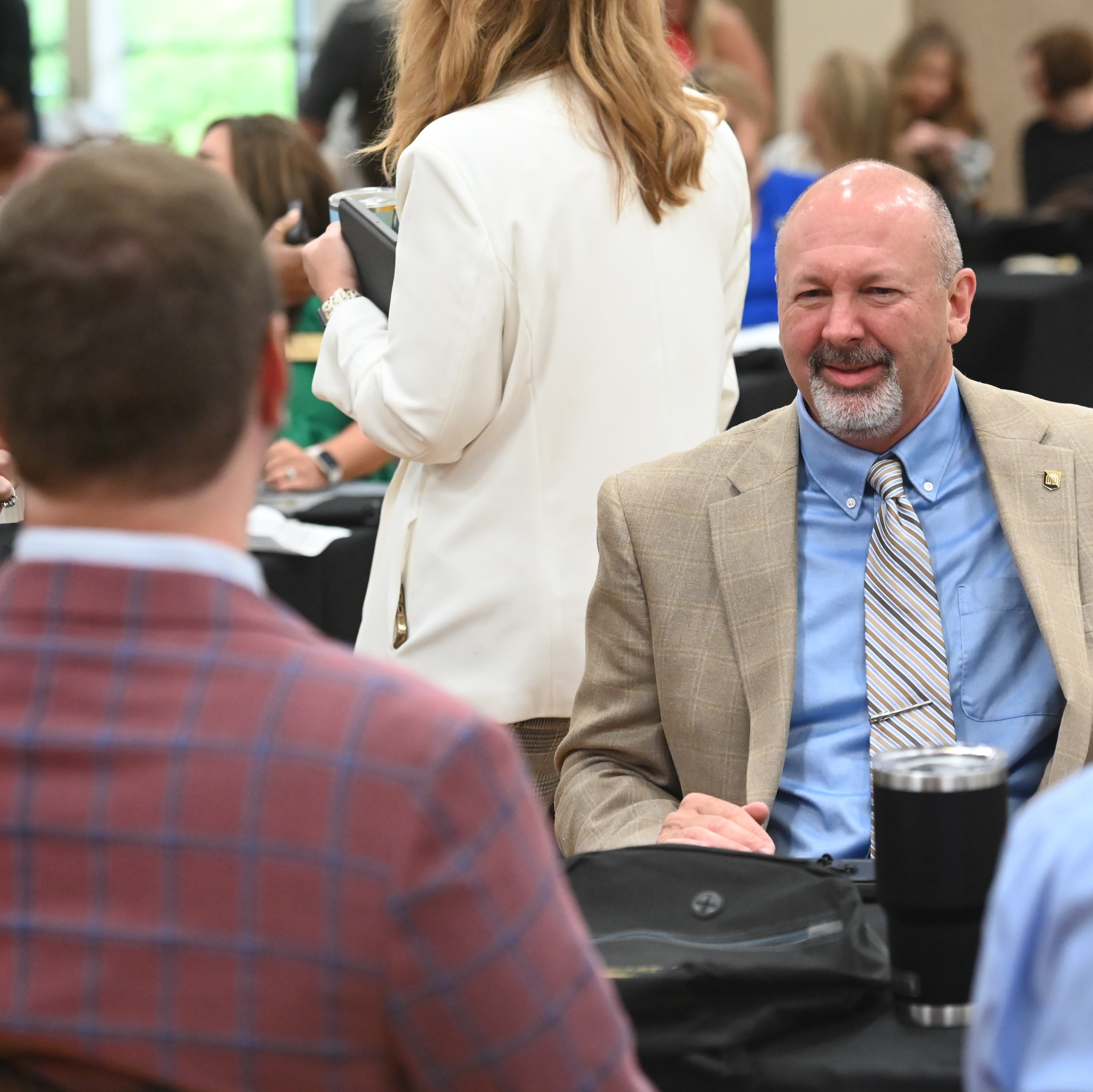 Northeast employees engaged in a casual conversation