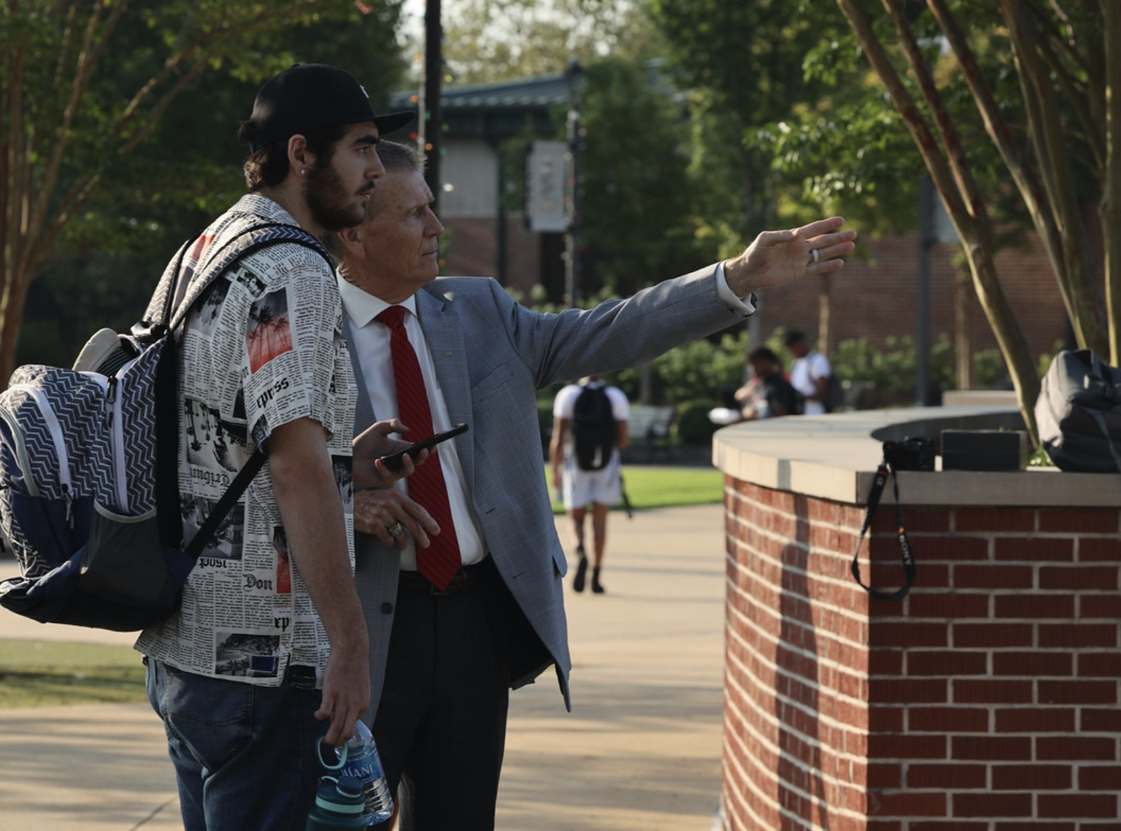 President helping student find first class