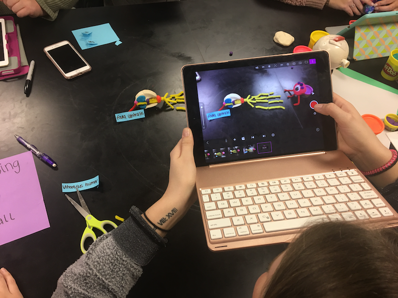 Photo of an iPad screen of a student in biology lab.